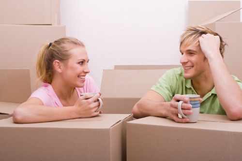 Movers planning access routes for piano removals in a Hammersmith home
