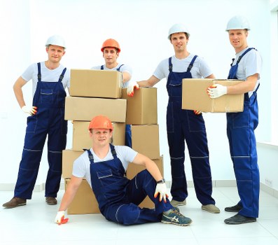 Loading furniture into a removal truck in Hammersmith