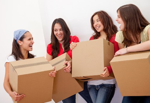 Professional movers handling office furniture during a Hammersmith relocation