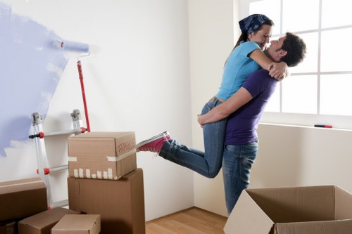 Professional movers transporting office furniture in Hammersmith