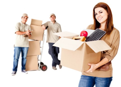 Furniture removal team handling heavy items in a Hammersmith property