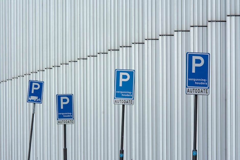 The image shows an underground parking garage entrance with a black ceiling and brick walls on either side. In the foreground, a signboard indicates parking restrictions, including a parking lot numbe